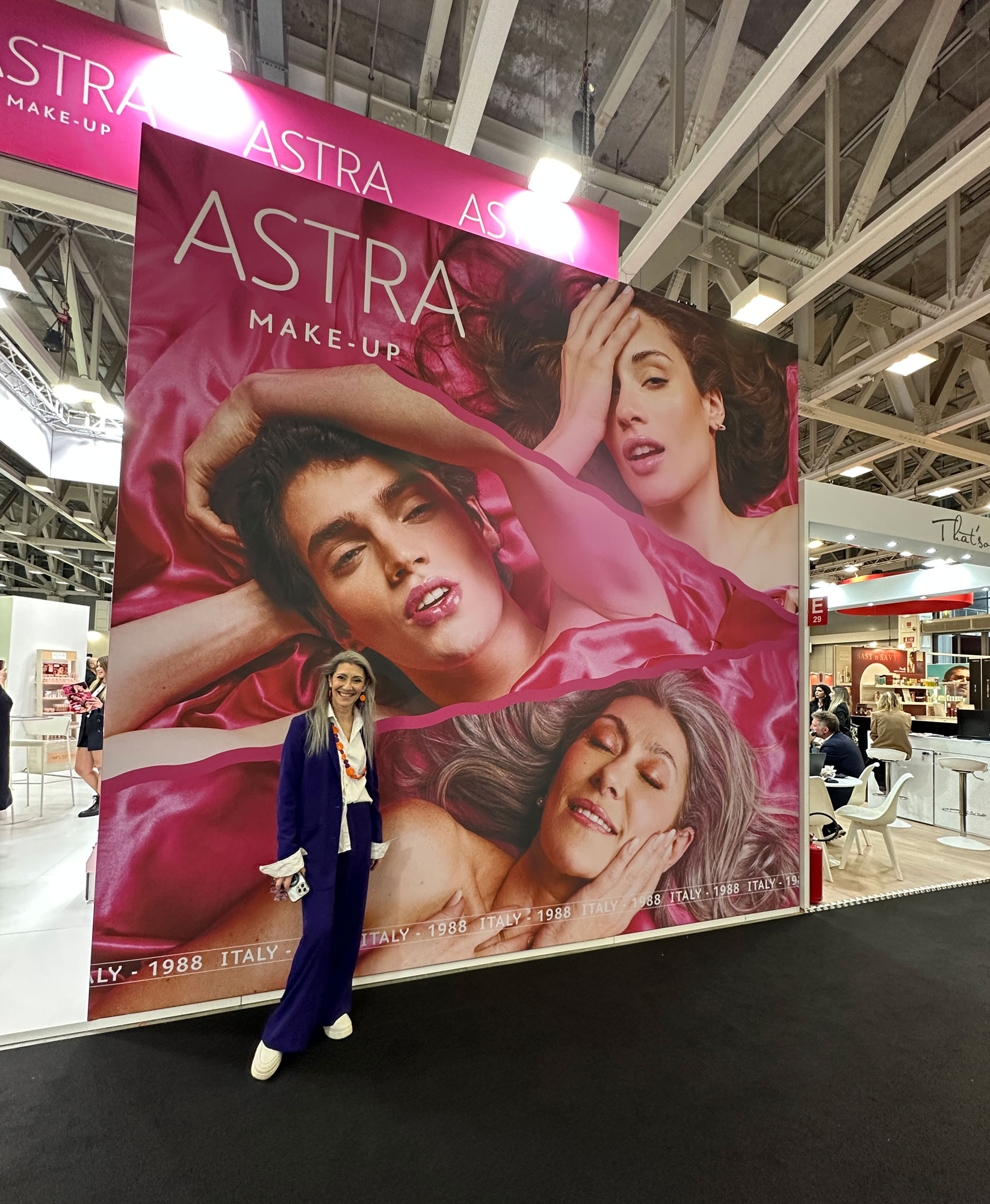 Valeria Sechi, Italian grey hair model, at Cosmoprof 2026 for Astra Make-Up.