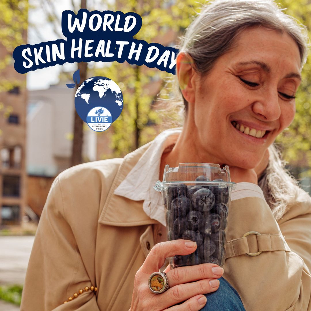 Close-up of Valeria Sechi smiling while holding a pack of Livie blueberries