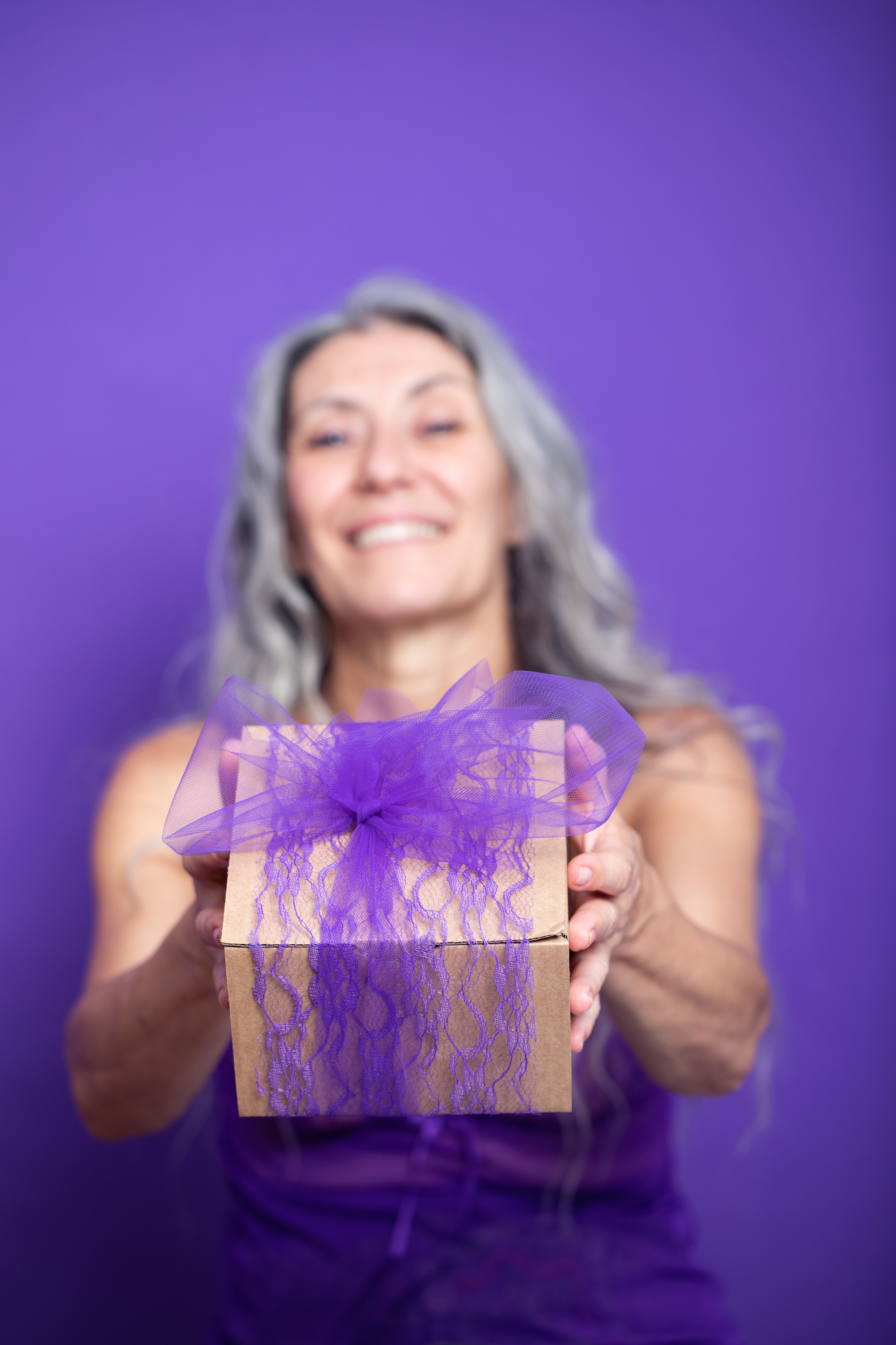 Grey model Valeria Sechi in a shot with purple background for Lace Beauty campaign