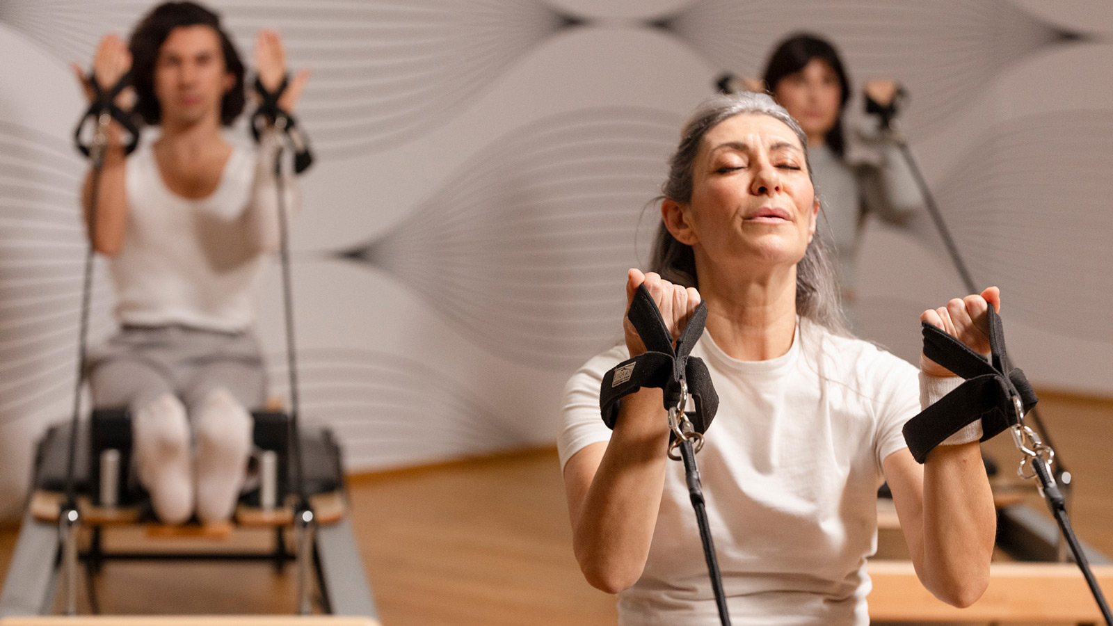 Grey hair moodel Valeria Sechi in Reformer Pilates campaign for Virgin Active.