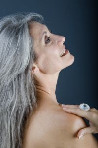 A colour portrait of grey hair model Valeria Sechi wearing a ring