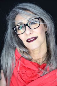 A portrait of grey model Valeria Sechi wearing black eyeglasses