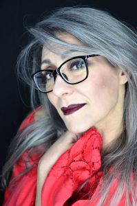A portrait of grey model Valeria Sechi wearing black eyeglasses