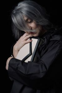 Grey hair model Valeria Sechi posing with a bag