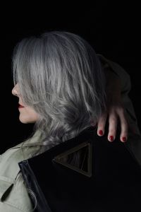 Grey hair model Valeria Sechi posing with a bag