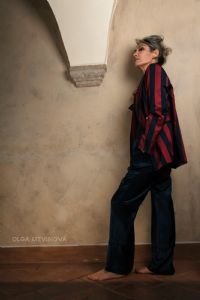 Grey hair model Valeria Sechi wearing a jacket and a tulle skirt