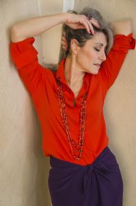 Grey hair model Valeria Sechi wearing a red fashion shirt