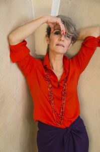 Grey hair model Valeria Sechi wearing a red fashion shirt