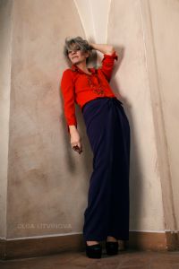 Grey hair model Valeria Sechi wearing a red fashion shirt