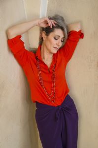 Grey hair model Valeria Sechi wearing a red fashion shirt