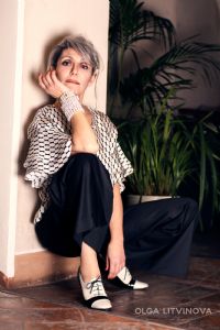 Grey hair model Valeria Sechi wearing fashion dress