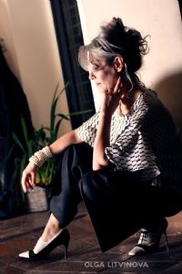 Grey hair model Valeria Sechi wearing fashion dress