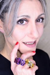 Grey hair model Valeria Sechi wearing jewels