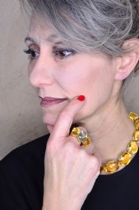 Grey hair model Valeria Sechi wearing jewels
