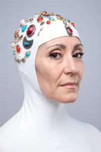 Italian grey hair model Valeria Sechi wearing a balaclava covered with jewels