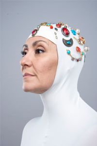 Italian grey hair model Valeria Sechi wearing a balaclava covered with jewels