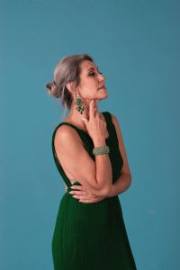 Italian grey hair model Valeria Sechi wearing a green dress