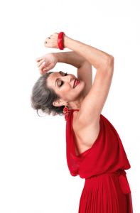 Italian grey hair model Valeria Sechi wearing a red dress