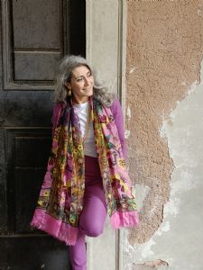 Portrait of Italian grey hair model Valeria Sechi in purple suit