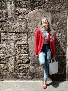 Portrait of Italian grey hair model Valeria Sechi in red jacket