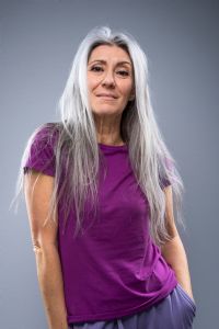 Portrait of Italian grey hair model Valeria Sechi with purple tshirt