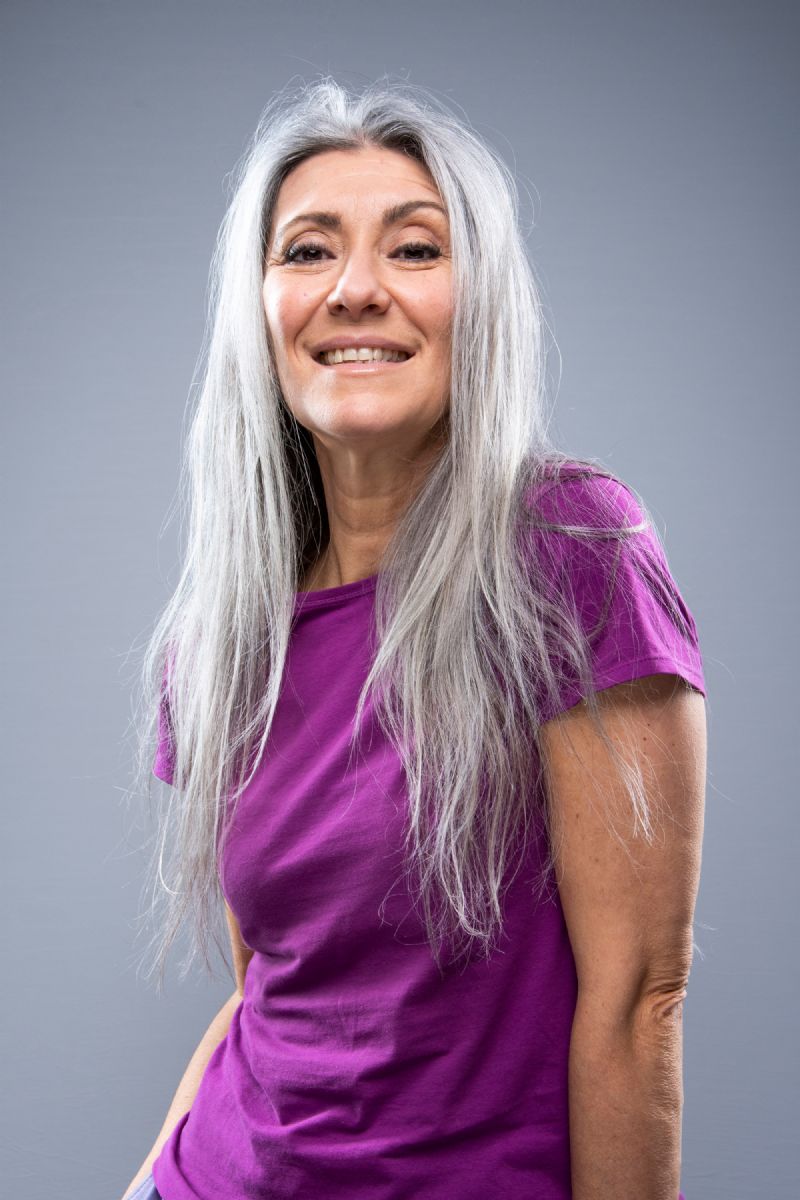 Portrait of Italian grey hair model Valeria Sechi with purple tshirt