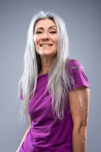 Portrait of Italian grey hair model Valeria Sechi with purple tshirt