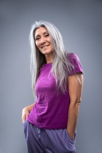 Portrait of Italian grey hair model Valeria Sechi with purple tshirt