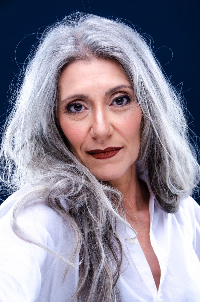Portrait of Italian grey hair model Valeria Sechi with white shirt