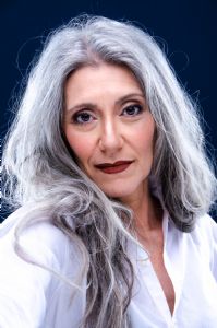 Portrait of Italian grey hair model Valeria Sechi with white shirt